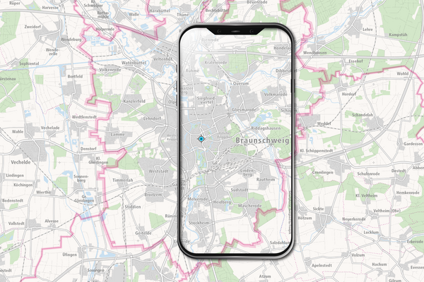 Symbolbild mit Smartphone auf einer Karte (Wird bei Klick vergrößert)